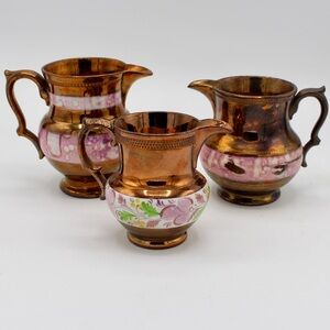 Set of Three Antique Staffordshire Copper Luster Pitchers in Shades of Pink